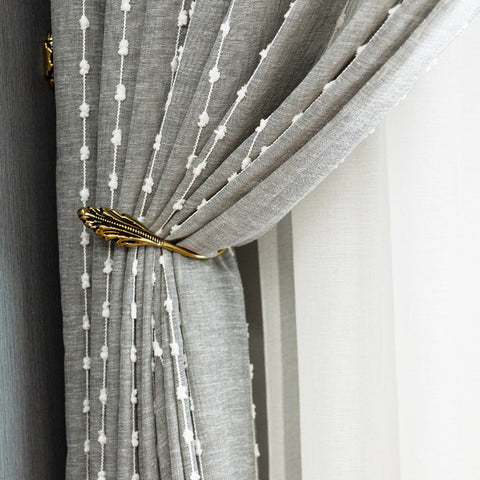 Tenda velata grigio chiaro con pompon