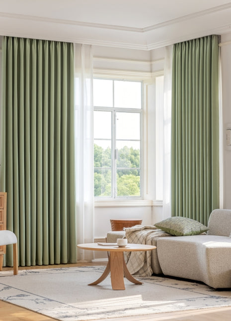 a living room filled with furniture and a large window