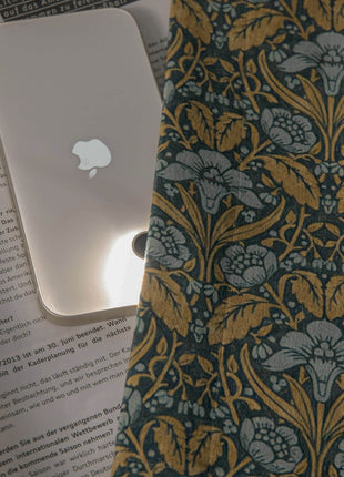 an apple computer sitting on top of a book