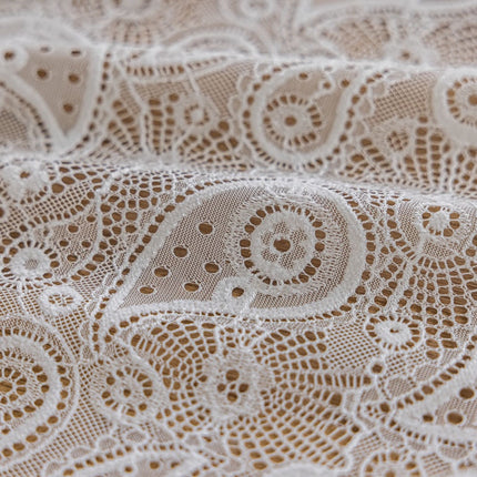 a close up of a white lace fabric