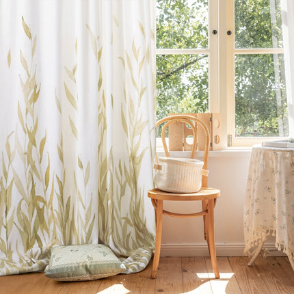 a chair sitting next to a window in a room