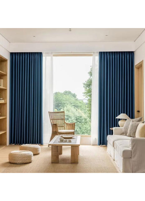 a living room filled with furniture and a large window