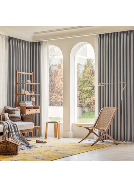 a living room filled with furniture and a large window