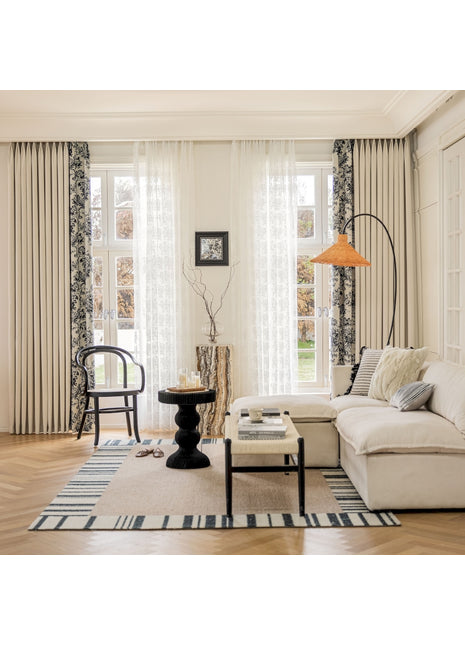 a living room filled with furniture and a lamp