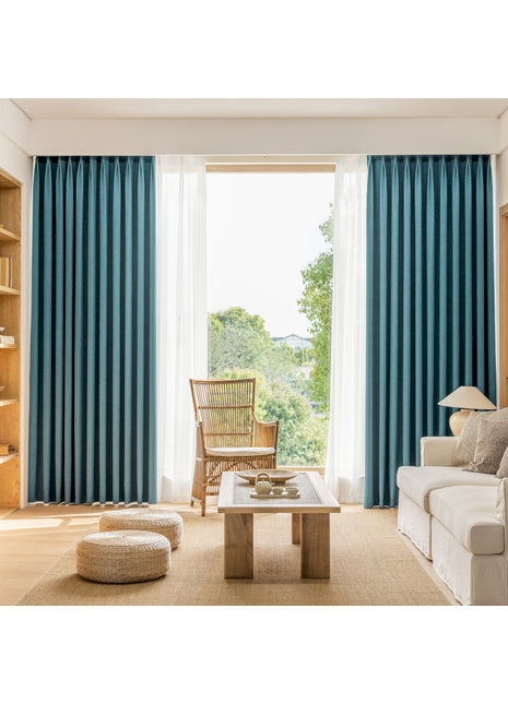 a living room filled with furniture and a large window