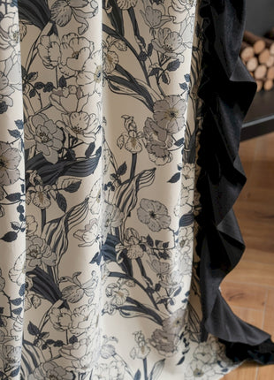 a close up of a curtain with flowers on it