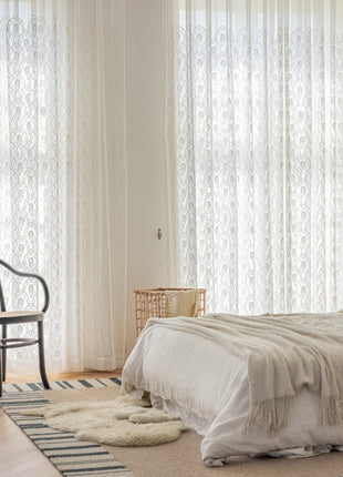 a bedroom with a bed and a chair