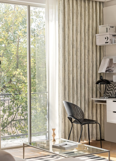 a living room with a glass coffee table