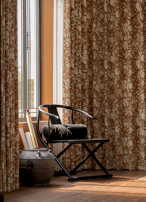 a chair sitting in a room next to a window