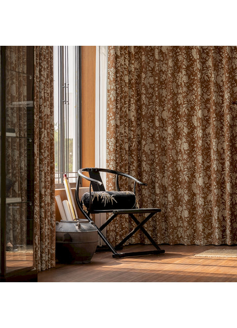 a chair sitting in a room next to a window