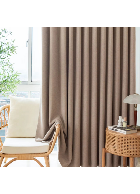 a living room with a chair and a window