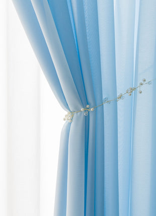 a close up of a curtain with flowers on it
