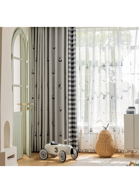 a child's room with a toy car in front of a window
