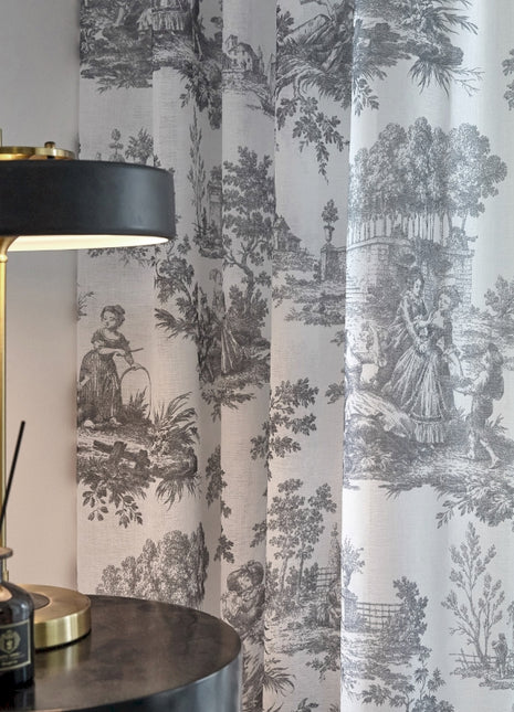 a lamp sitting on top of a table next to a window