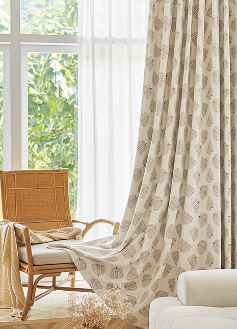 a living room with a chair and a window