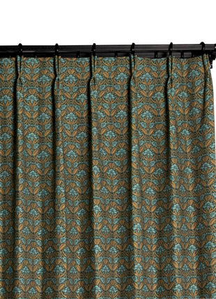 a close up of a curtain with a floral pattern