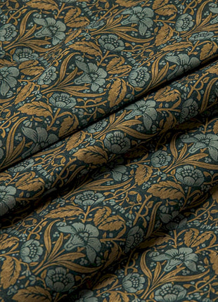 a close up of a blue and gold fabric
