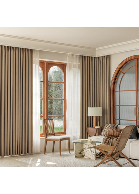 a living room filled with furniture and a large window
