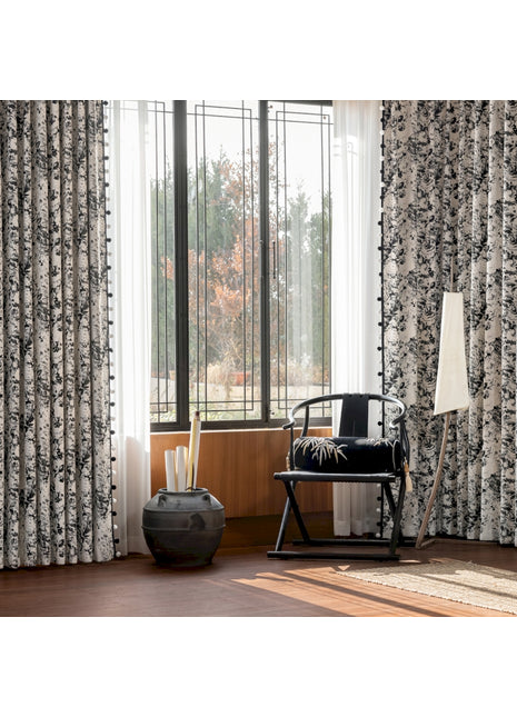 a living room with a chair and a large window