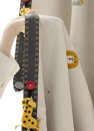 a person holding a curtain with a giraffe on it