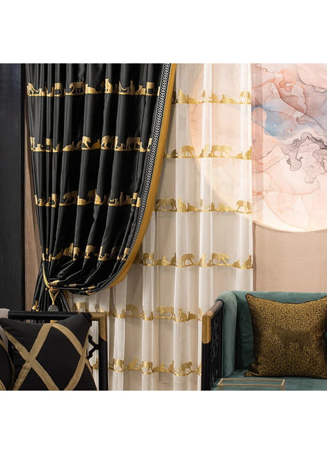 a living room with a couch, chair and curtains