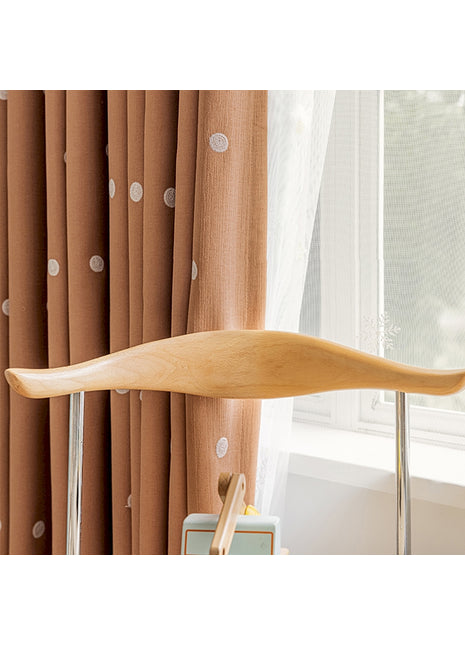 a wooden paddle sitting on top of a table next to a window