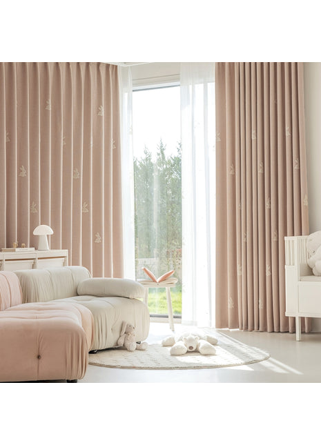 a living room filled with furniture and a large window