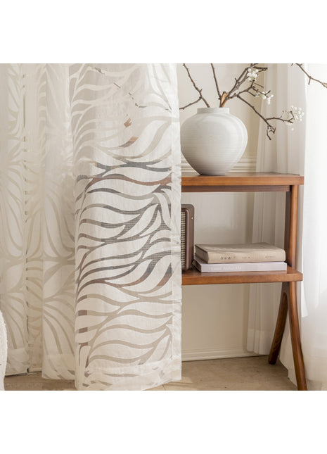 a white vase sitting on top of a wooden shelf
