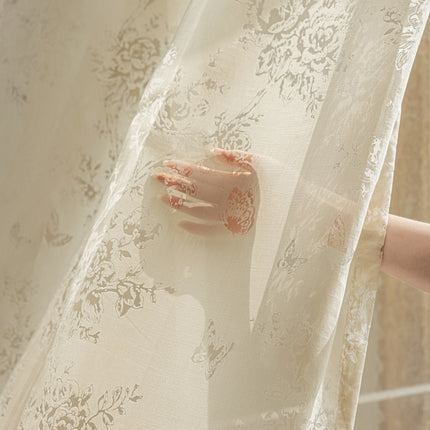 a hand is sticking out of a sheer curtain