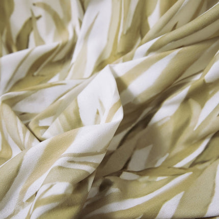 a close up of a yellow and white fabric